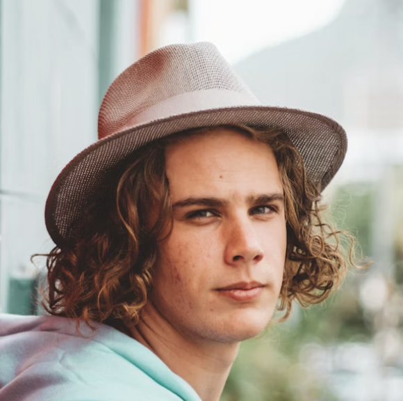 Portrait young man wearing hat